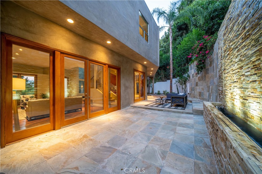 4104 Vanetta Place Studio City, CA 91604 - Photo 43 of 45 a view of a patio with table and chairs and potted plants