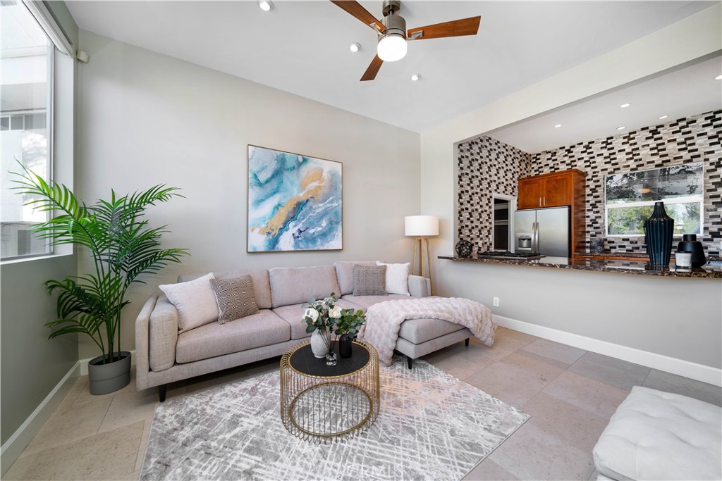 4104 Vanetta Place Studio City, CA 91604 - Photo 10 of 45 a living room with furniture and a painting on the wall