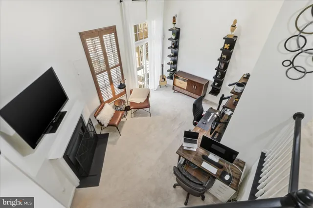 a view of a livingroom with furniture and a window