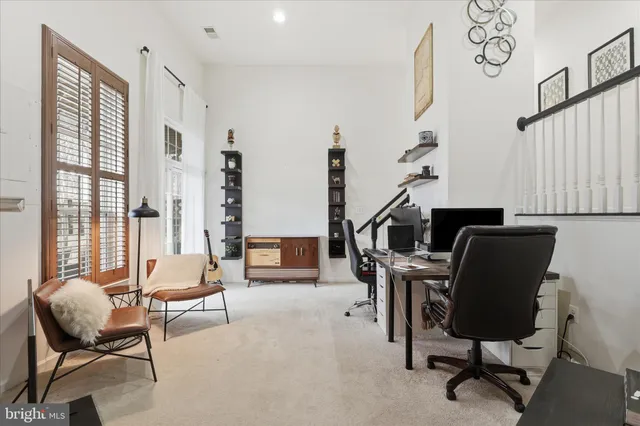 a bathroom with a toilet a sink and a mirror