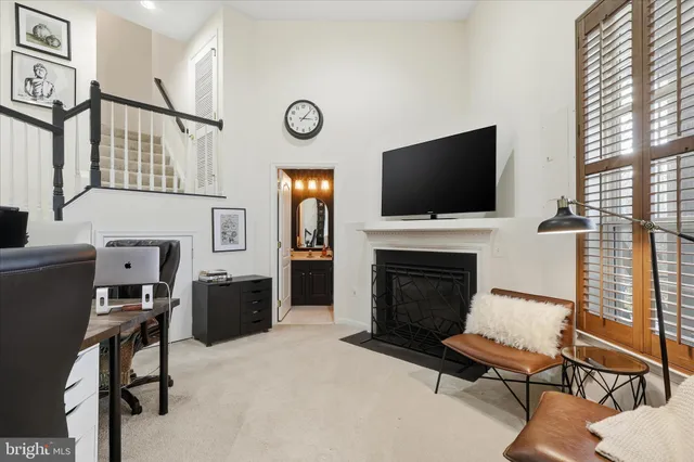 a spacious bedroom with a bed and a large window