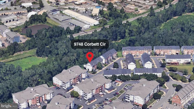 an aerial view of a house with a garden