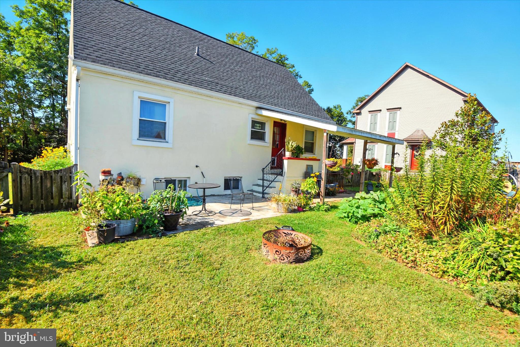 307 East Locust Street Union Bridge, MD 21791 - Photo 21 of 35 a front view of a house with swing and plants