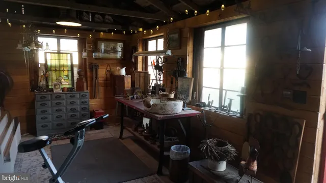 a room with lots of furniture and windows