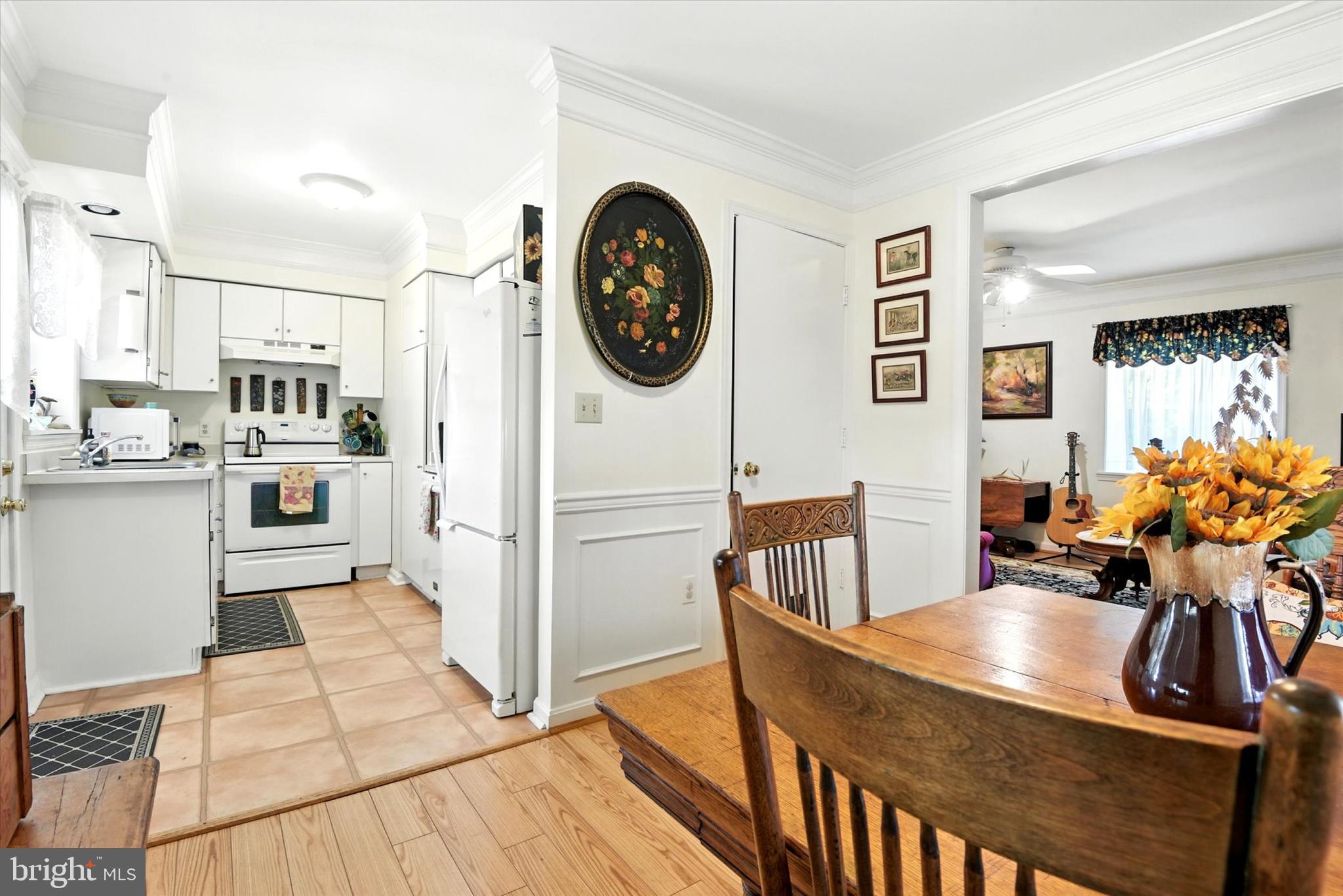 307 East Locust Street Union Bridge, MD 21791 - Photo 5 of 35 a view of a kitchen with dining table and chairs