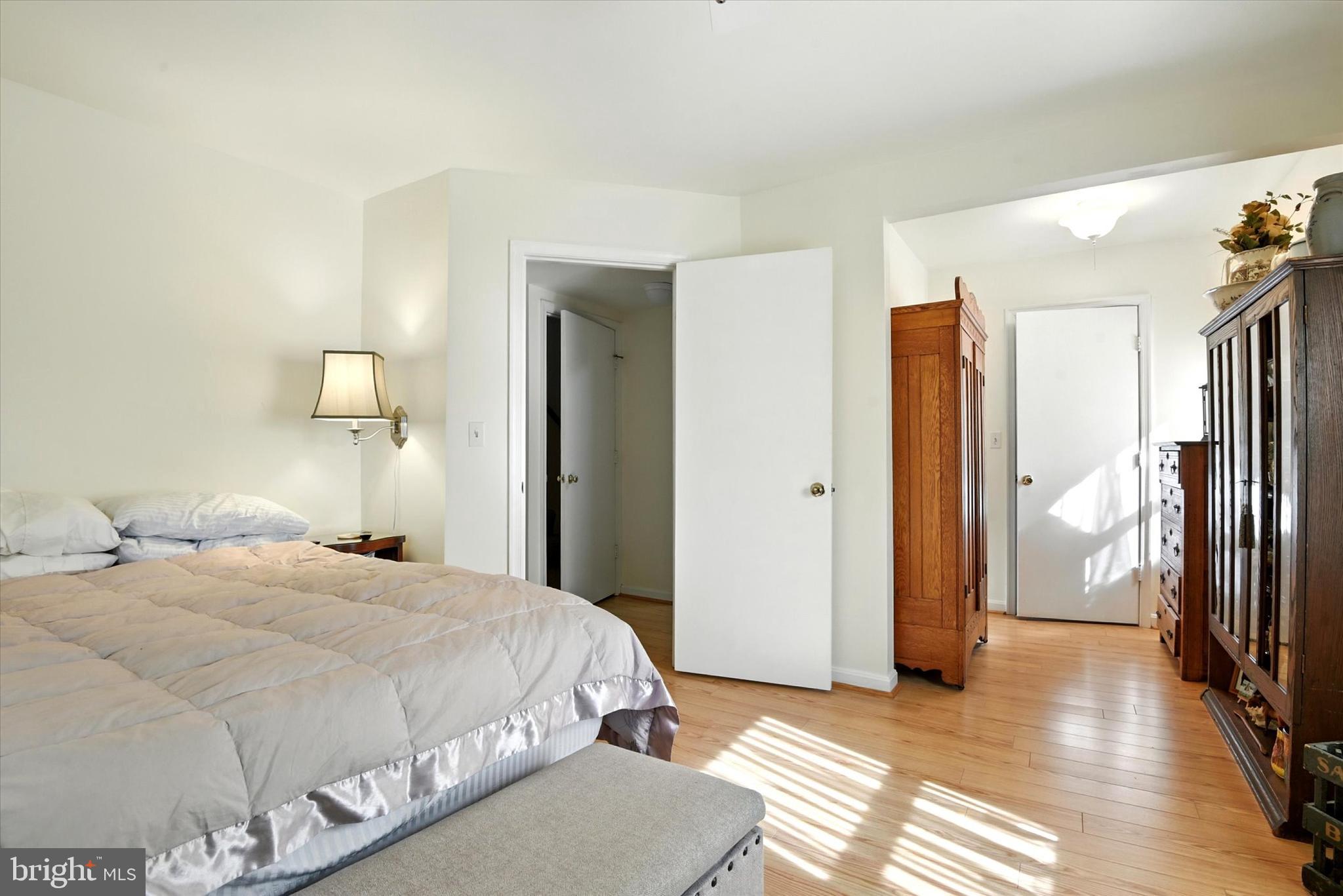 307 East Locust Street Union Bridge, MD 21791 - Photo 9 of 35 a bedroom with a bed and a mirror