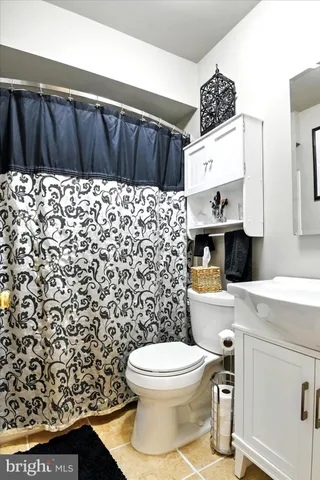 a bathroom with a toilet and a sink