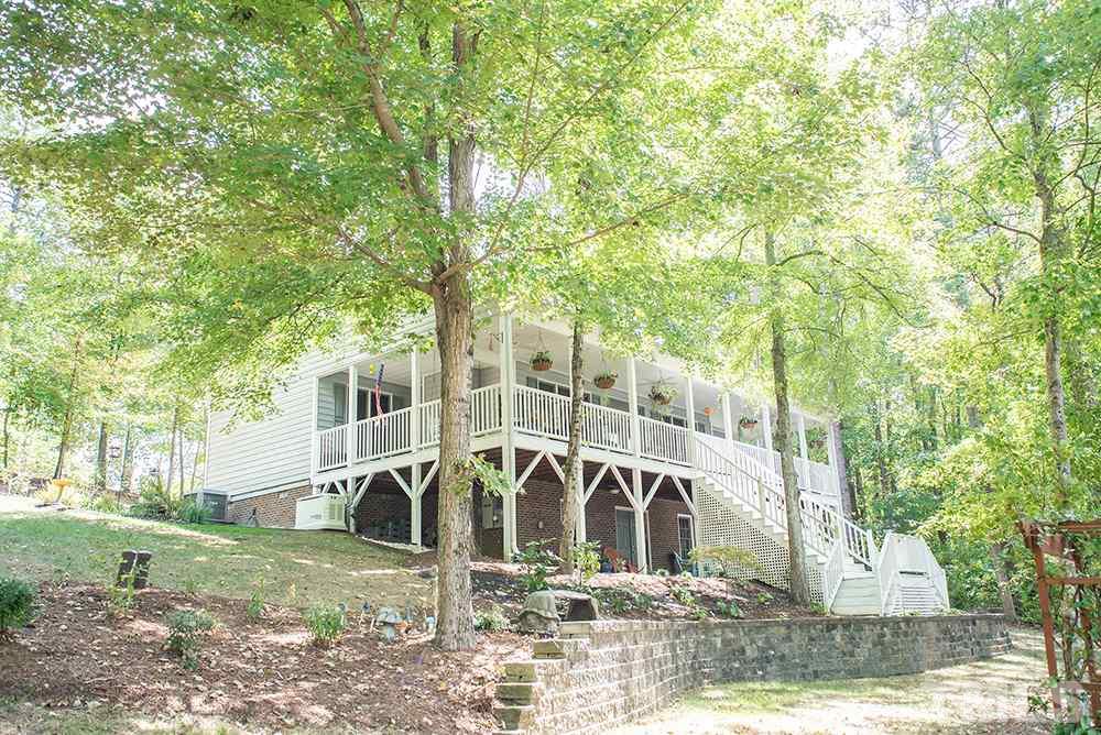 169 Willifords Point Road Roxboro, NC 27574 - Photo 1 of 30 a view of a house with backyard and trees