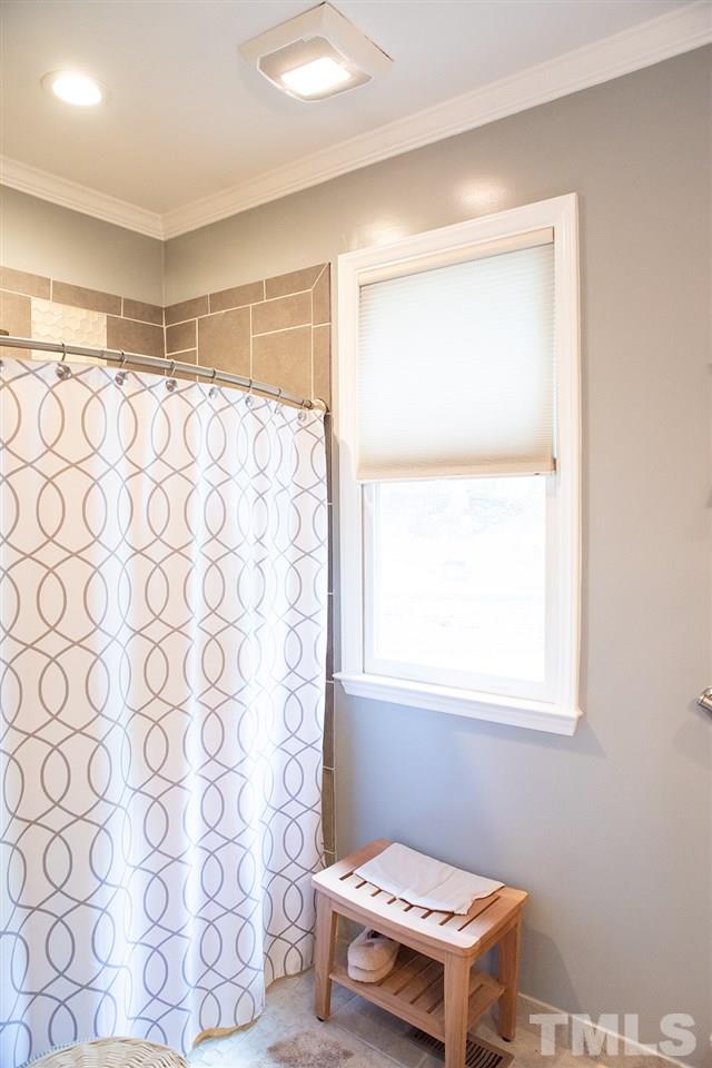 169 Willifords Point Road Roxboro, NC 27574 - Photo 16 of 30 a bathroom with a window and a shower