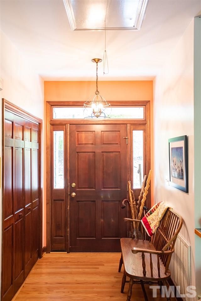 169 Willifords Point Road Roxboro, NC 27574 - Photo 21 of 30 a view of a room with furniture window and wooden floor