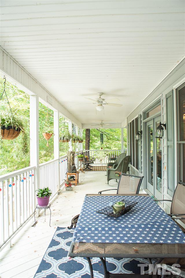 169 Willifords Point Road Roxboro, NC 27574 - Photo 25 of 30 a living room with furniture table and a large window