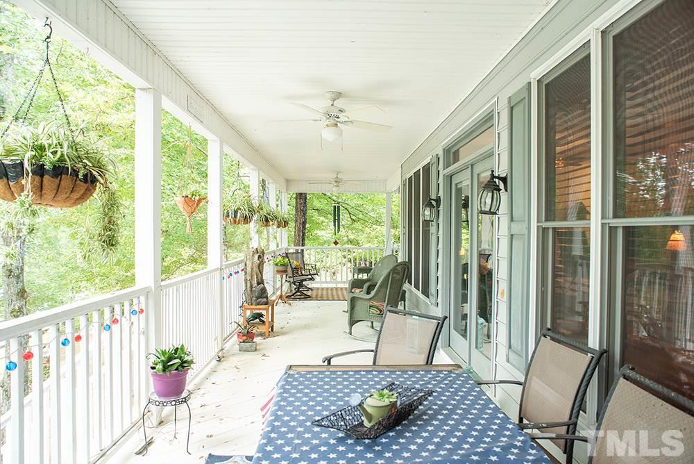 169 Willifords Point Road Roxboro, NC 27574 - Photo 26 of 30 a living room with large windows
