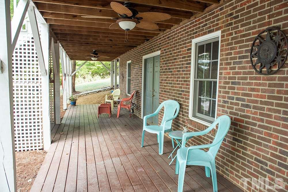 169 Willifords Point Road Roxboro, NC 27574 - Photo 29 of 30 a dining room with furniture and wooden floor