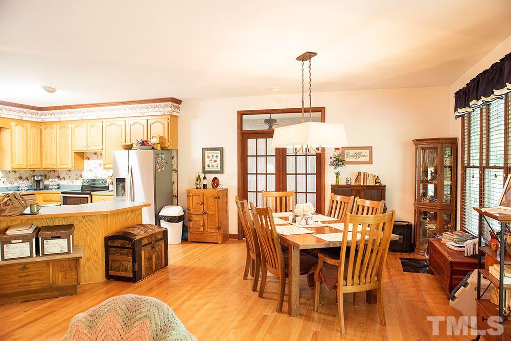 169 Willifords Point Road Roxboro, NC 27574 - Photo 8 of 30 a view of a dining room with furniture window and outside view