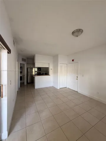 a view of a kitchen with a sink and dishwasher cabinets