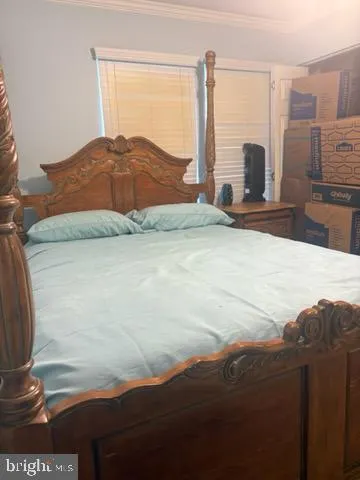 a view of a bedroom with a large window