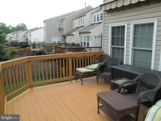 a view of a chair and tables on the roof deck