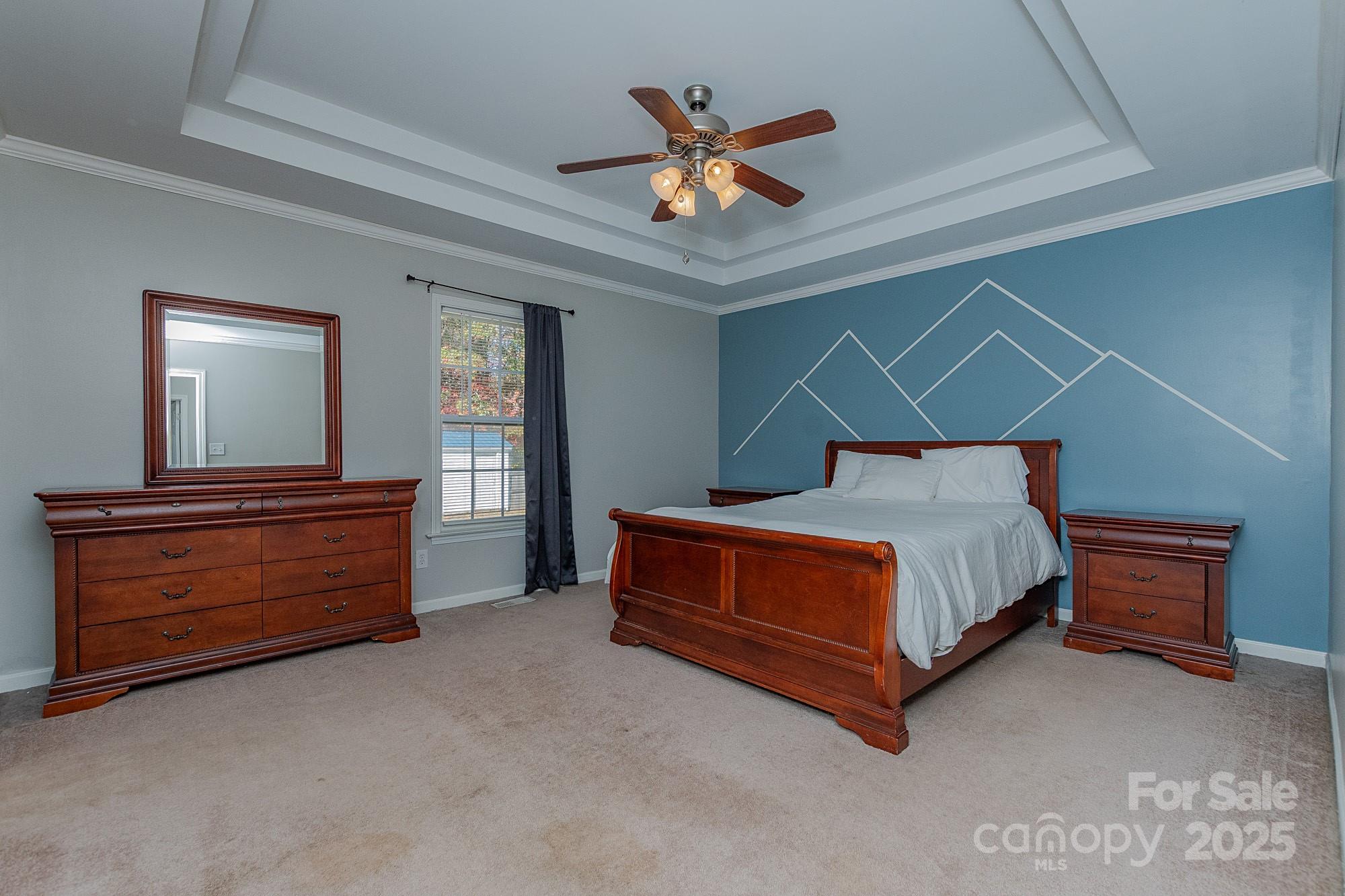 174 Isaiah Court Lexington, NC 27292 - Photo 12 of 37 a bedroom with a bed and a dresser