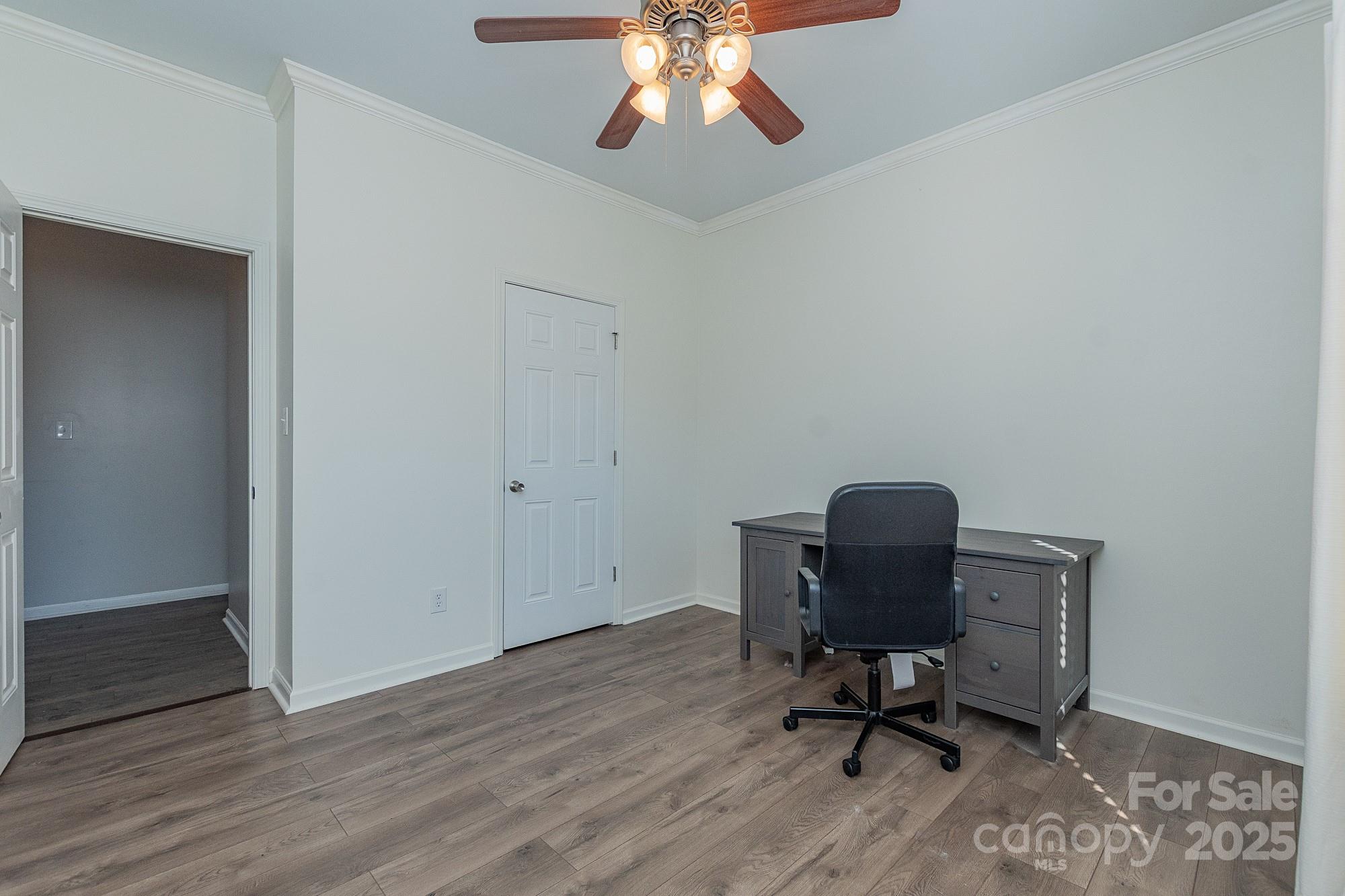 174 Isaiah Court Lexington, NC 27292 - Photo 17 of 37 a view of workspace with wooden floor and windows