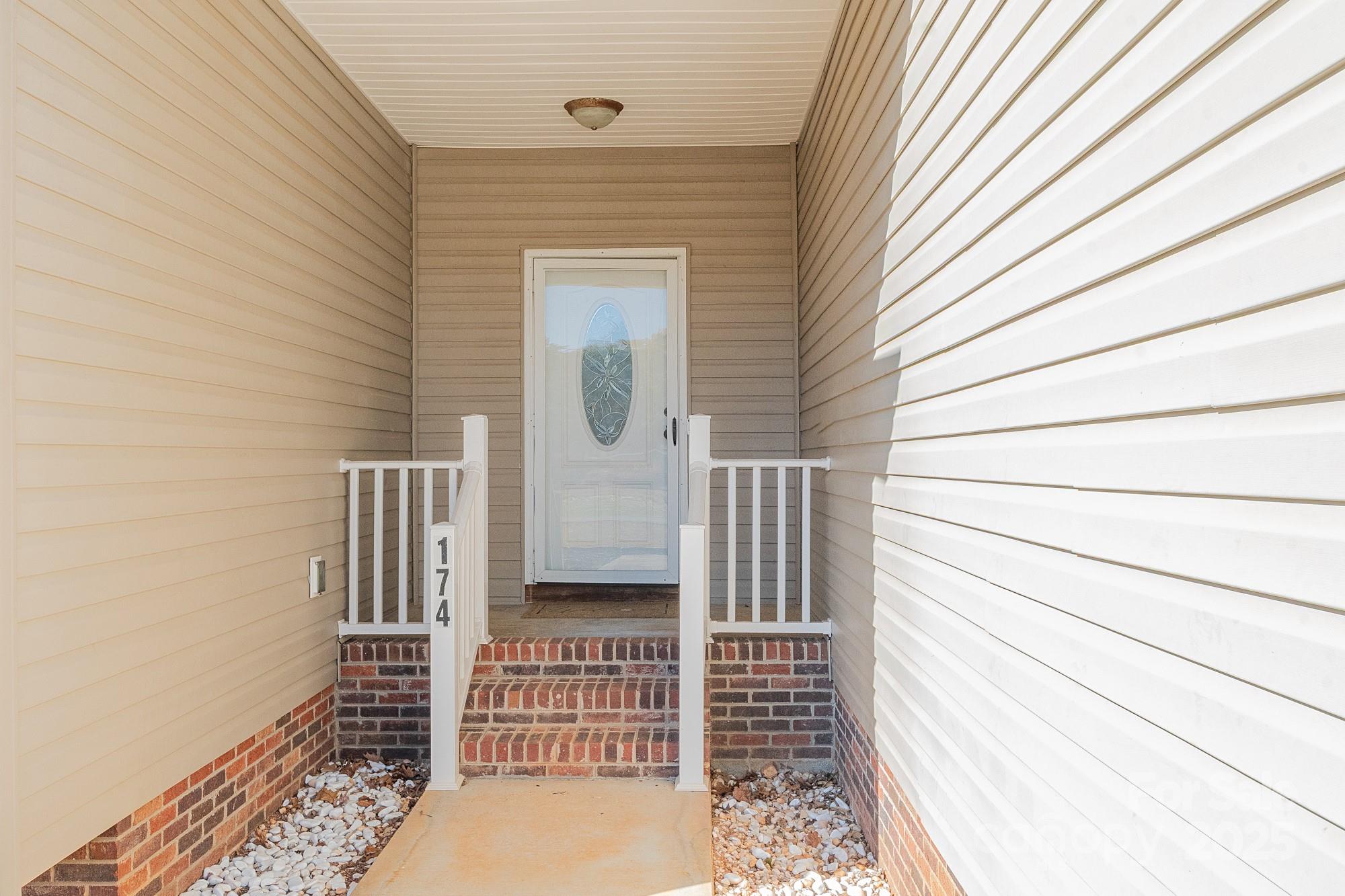 174 Isaiah Court Lexington, NC 27292 - Photo 2 of 37 a view of a house with a door and wooden floor