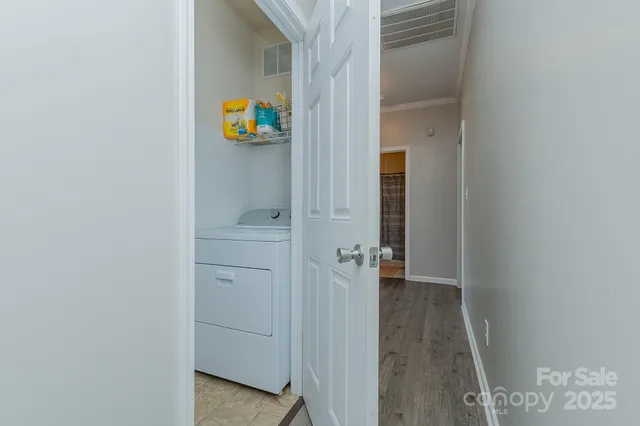 a view of an entryway with wooden floor