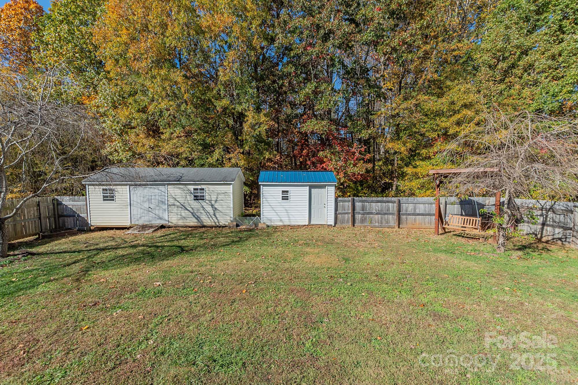 174 Isaiah Court Lexington, NC 27292 - Photo 24 of 37 a house with trees in front of it