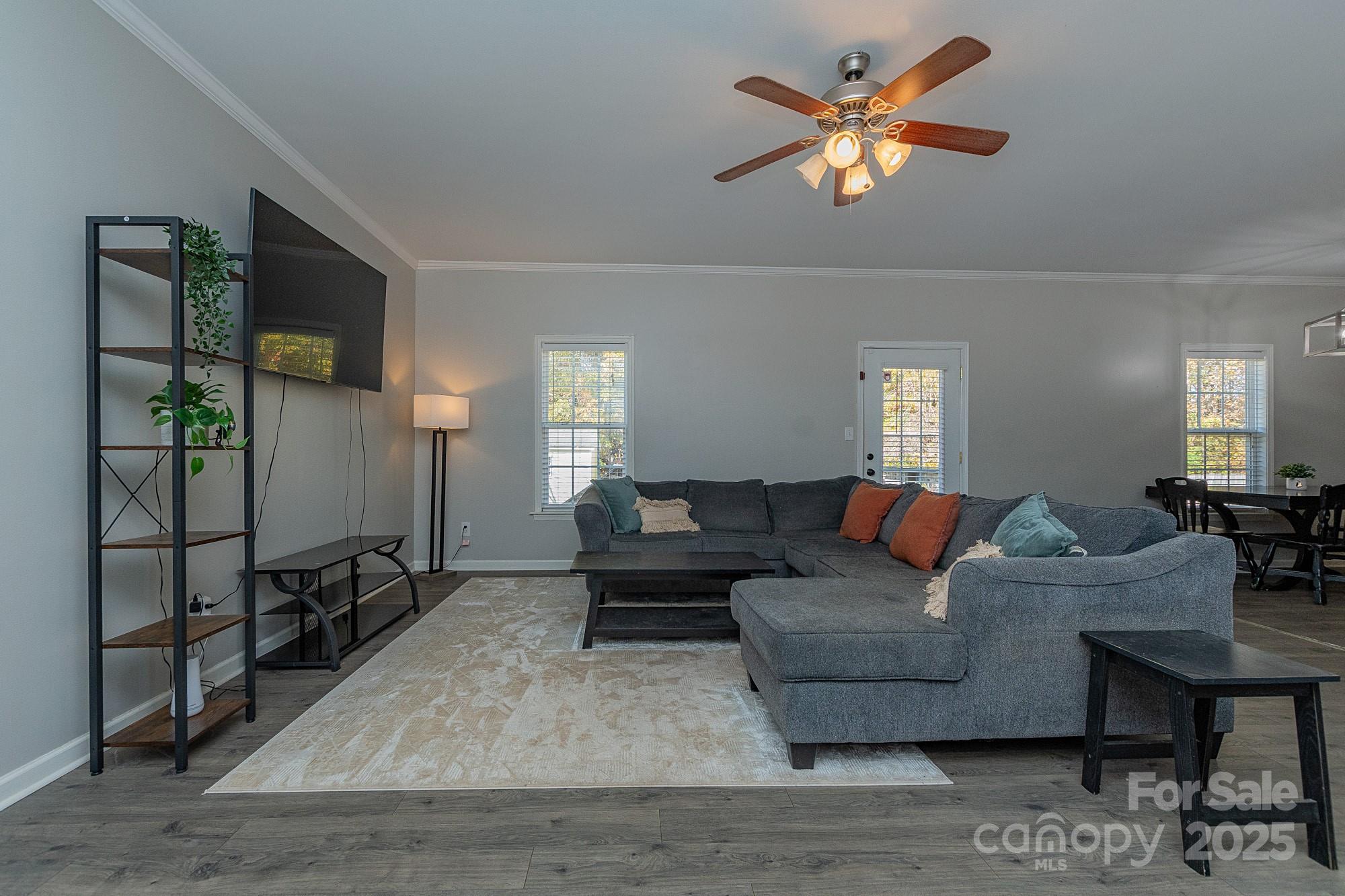 174 Isaiah Court Lexington, NC 27292 - Photo 4 of 37 a living room with furniture and a chandelier