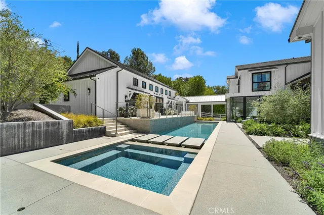 a view of house with swimming pool