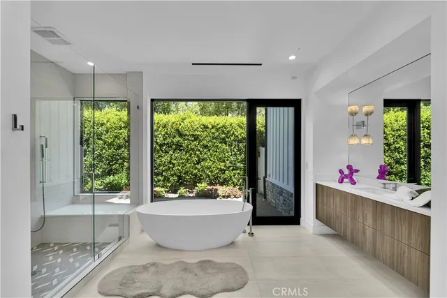 a very nice looking room with a large window and wooden floor