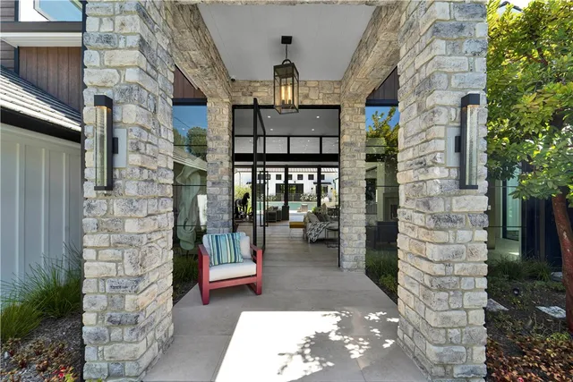 a glass door with couch