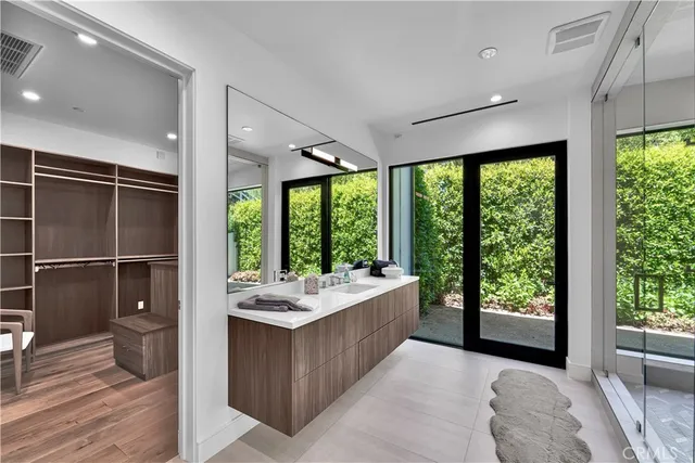 a room with a large window and furniture