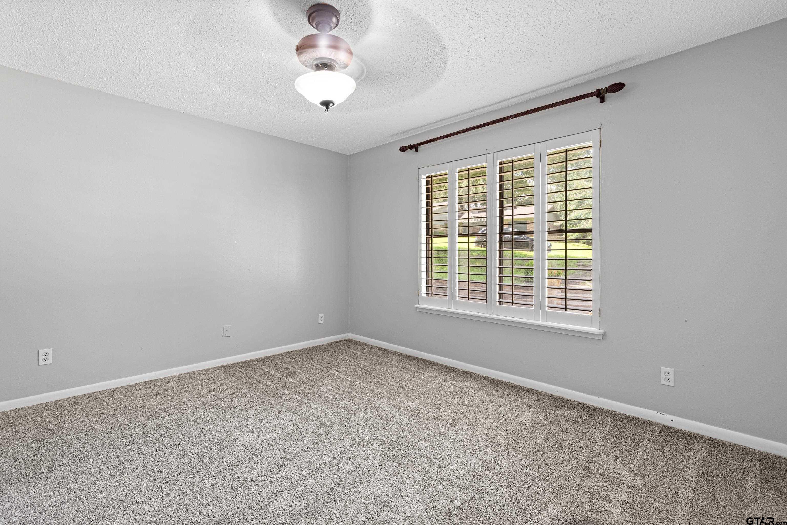 1821 Azalea Street Gilmer, TX 75644 - Photo 19 of 34 an empty room with a window