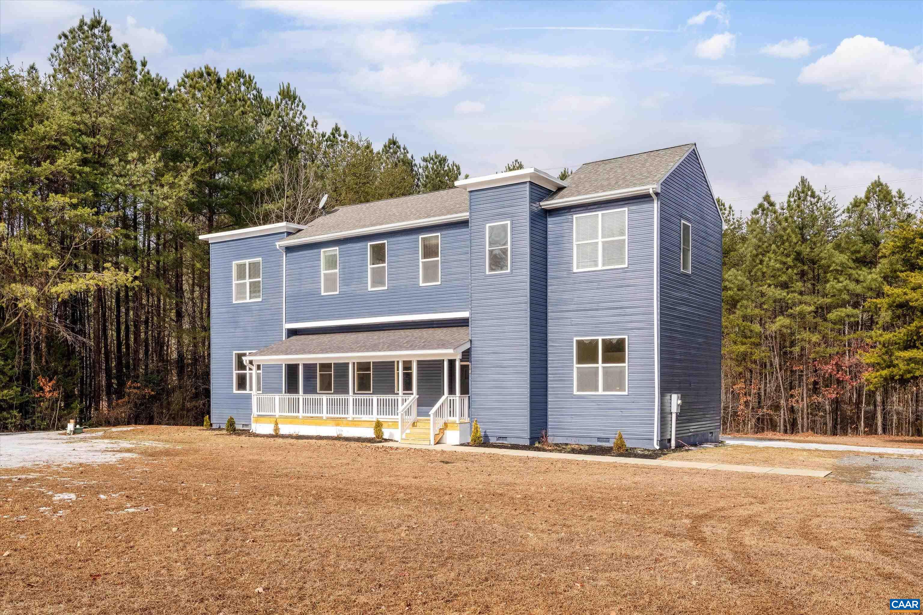 front view of a house with a yard