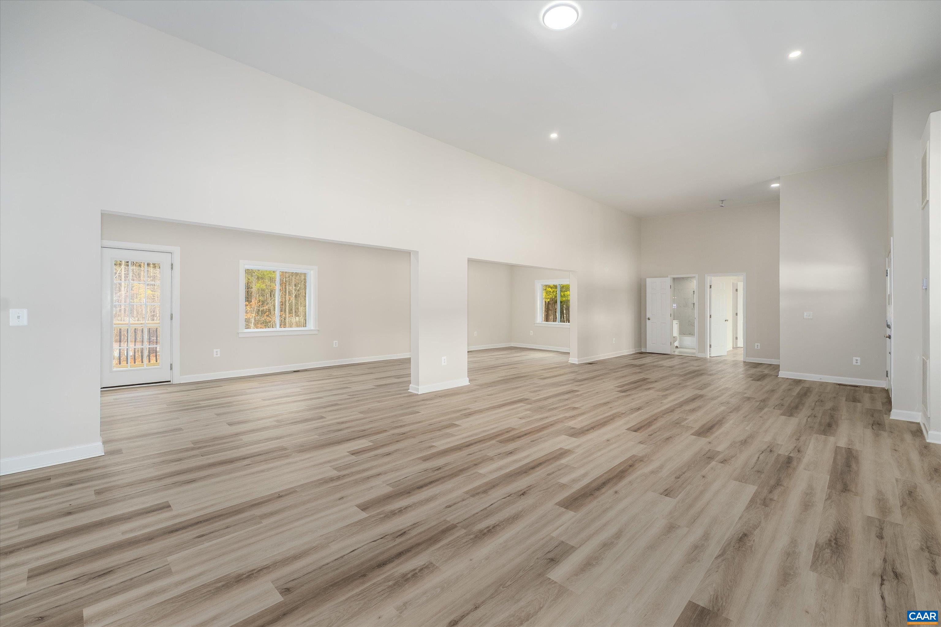 2301 Johnson Road Mineral, VA 23117 - Photo 13 of 37 an empty room with wooden floor and windows