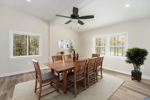 a dining room with furniture and window
