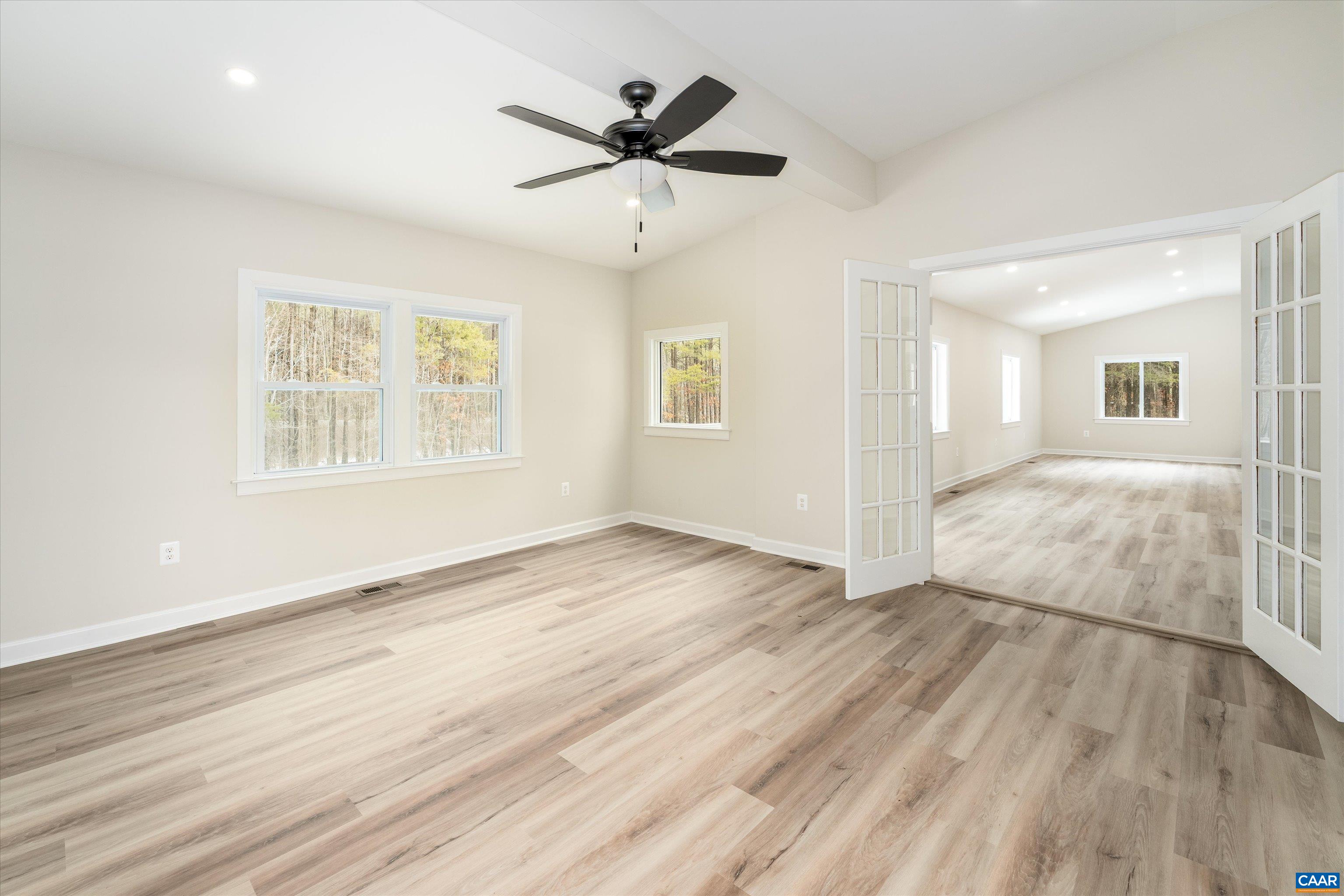 2301 Johnson Road Mineral, VA 23117 - Photo 16 of 37 an empty room with wooden floor and windows