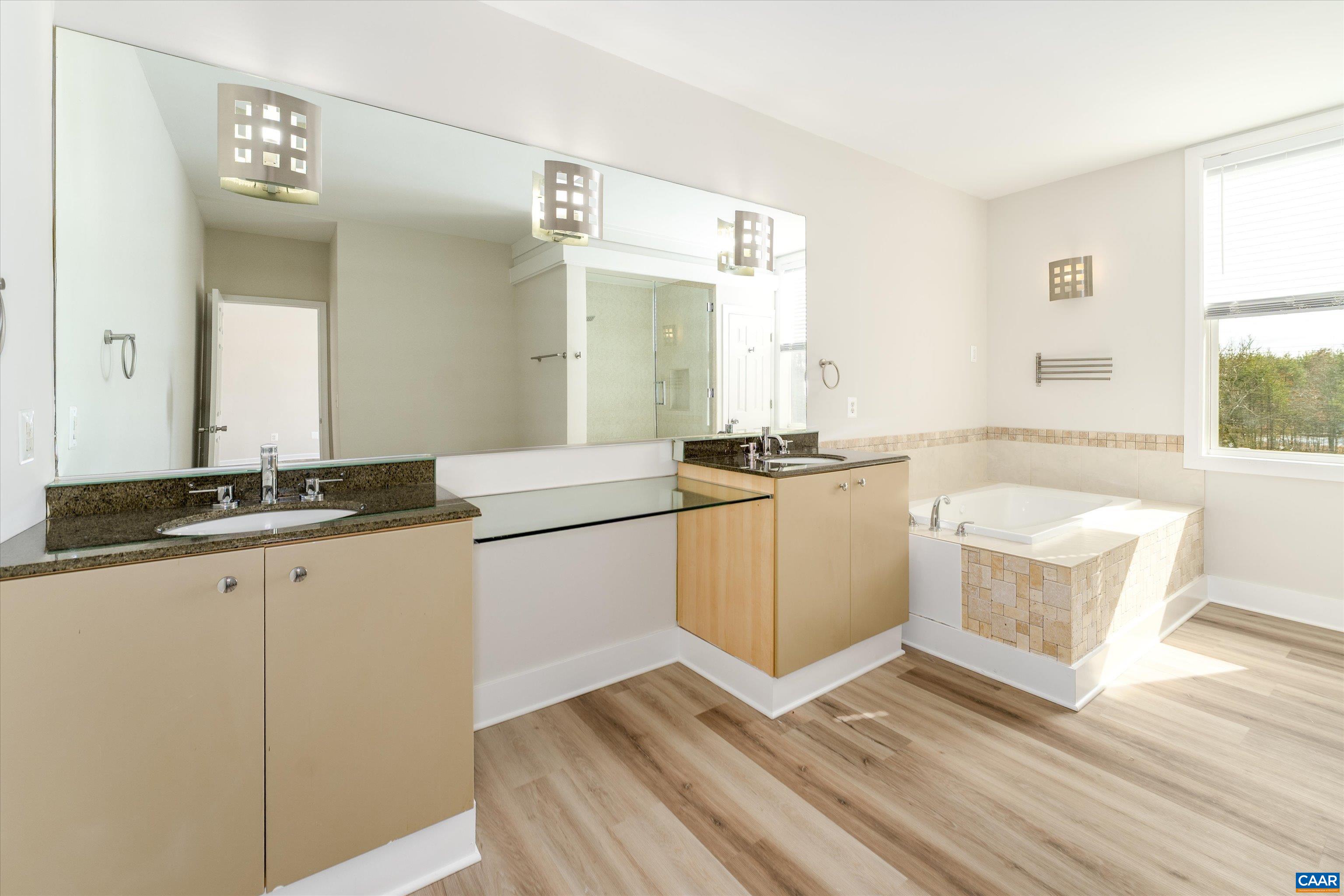 2301 Johnson Road Mineral, VA 23117 - Photo 26 of 37 a kitchen with granite countertop a stove a sink and a refrigerator