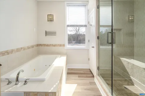 a bathroom with a bathtub and a sink