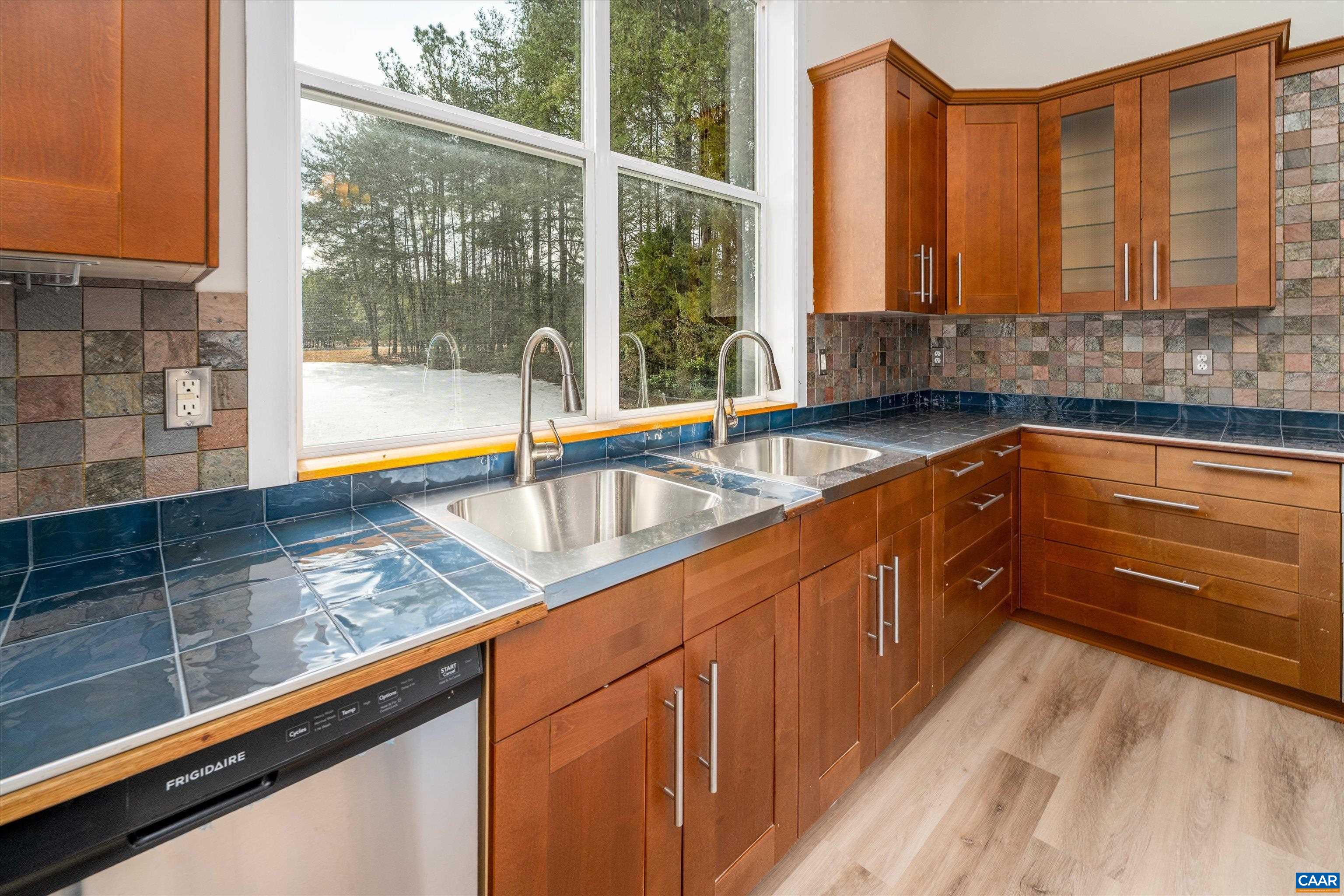 2301 Johnson Road Mineral, VA 23117 - Photo 5 of 37 a kitchen with granite countertop a sink and a wooden floor