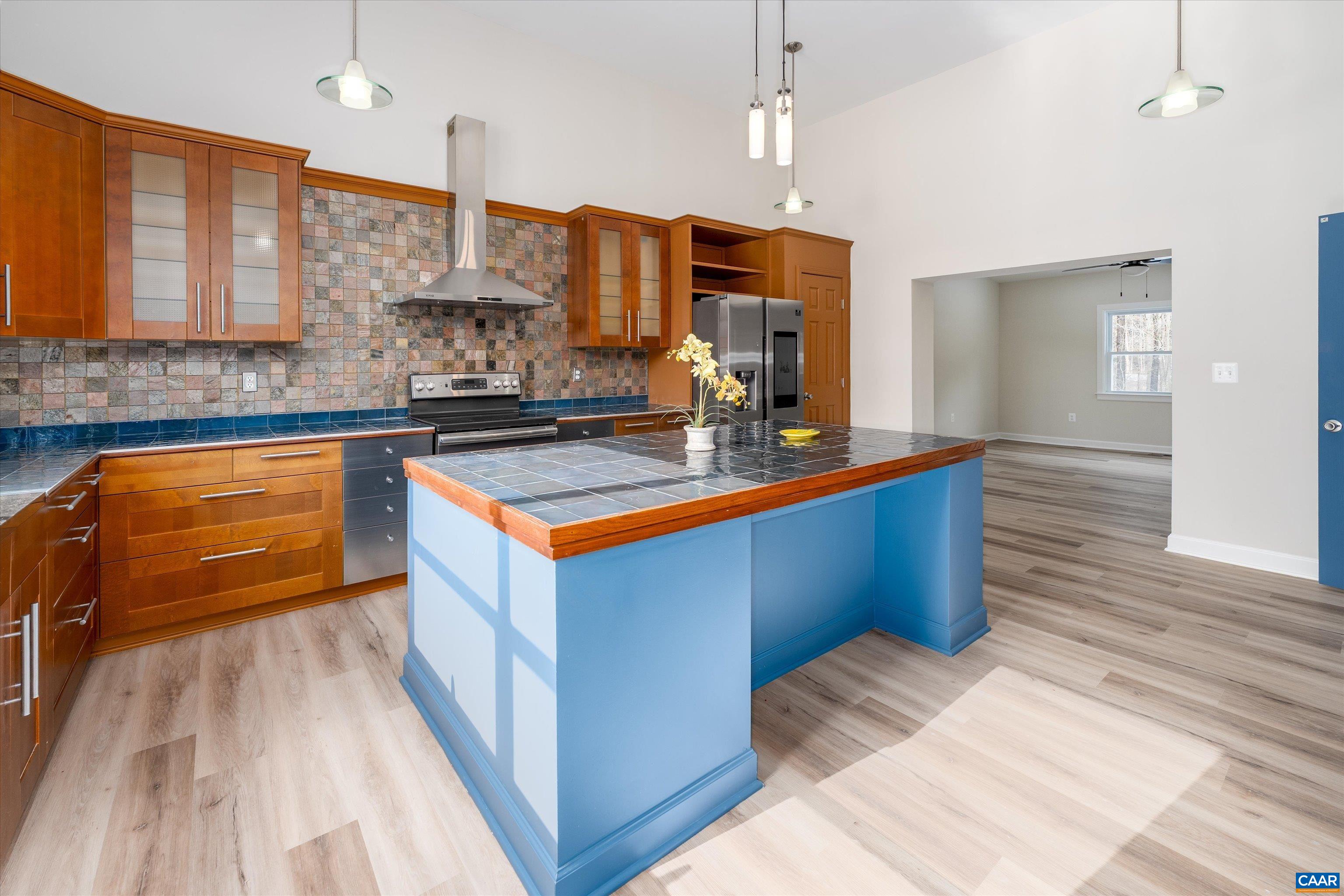 2301 Johnson Road Mineral, VA 23117 - Photo 6 of 37 a kitchen with stainless steel appliances kitchen island granite countertop a sink a counter space and cabinets