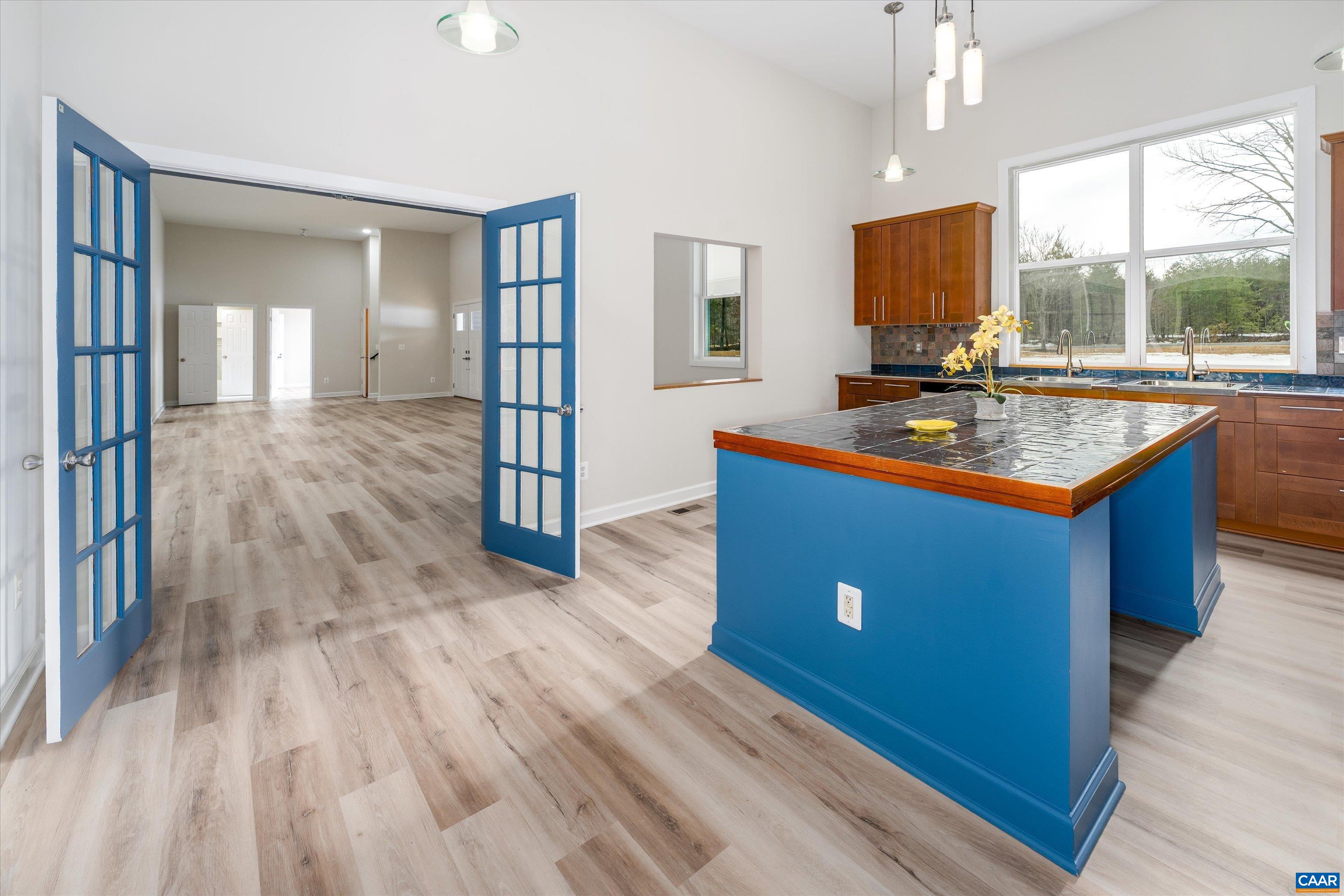 2301 Johnson Road Mineral, VA 23117 - Photo 10 of 37 a kitchen with wooden floors sink and cabinets