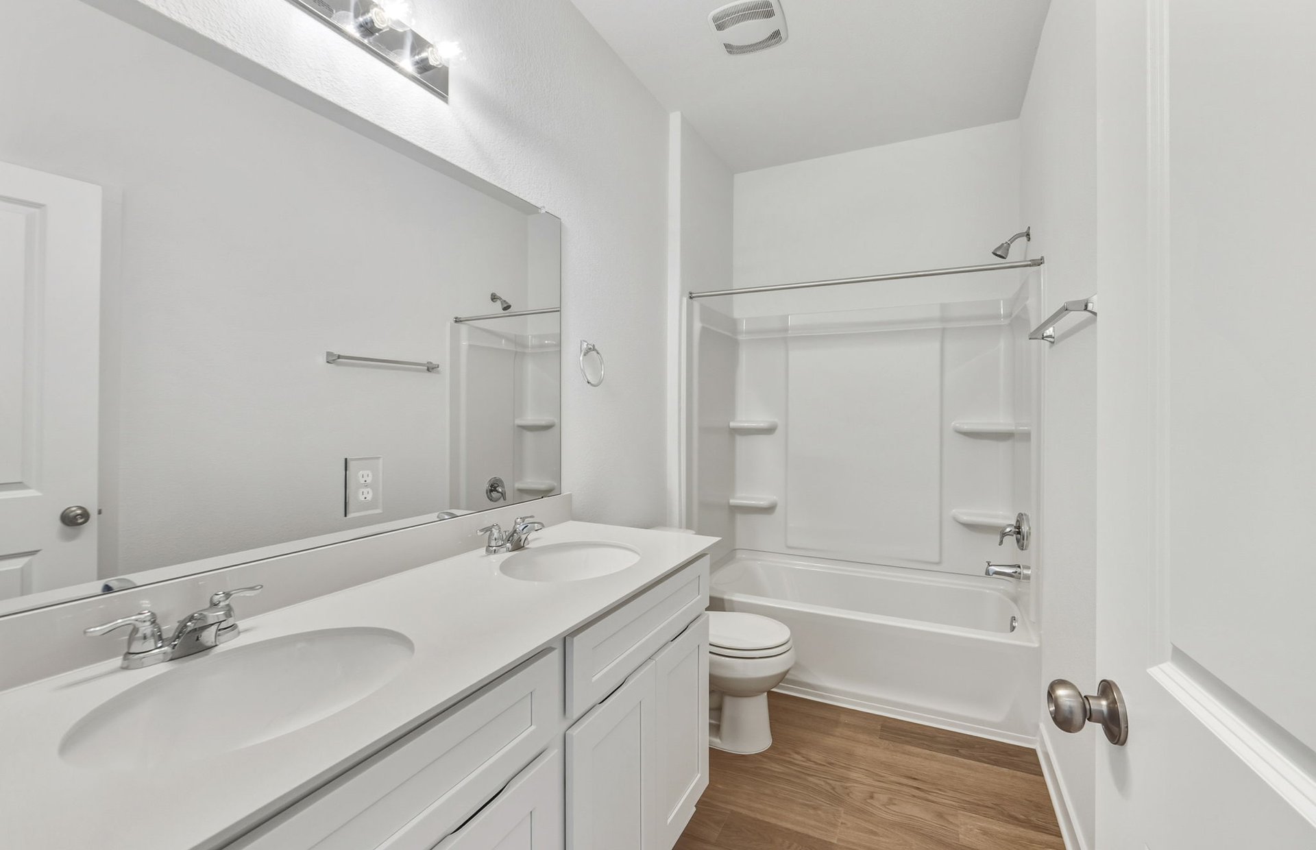 104 Eagle Valley Drive Elgin, TX 78621 - Photo 13 of 18 a bathroom with a bathtub shower sink vanity mirror and toilet