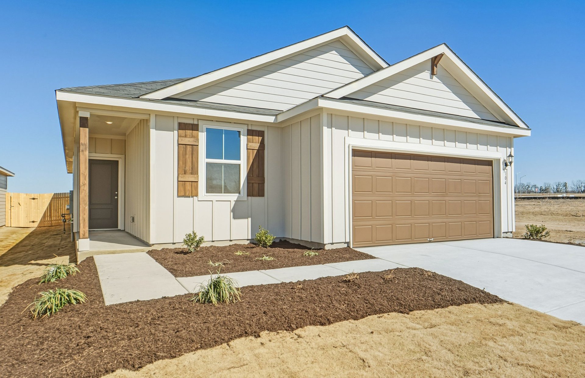 104 Eagle Valley Drive Elgin, TX 78621 - Photo 2 of 18 a front view of a house with a yard