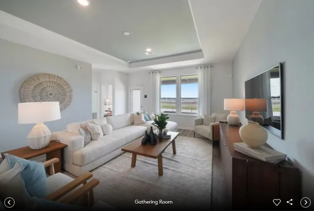 a living room with furniture and a lamp