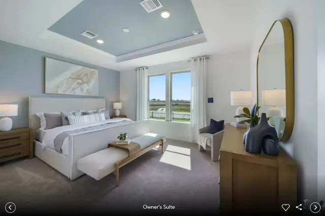 a spacious bedroom with a bed and a couch