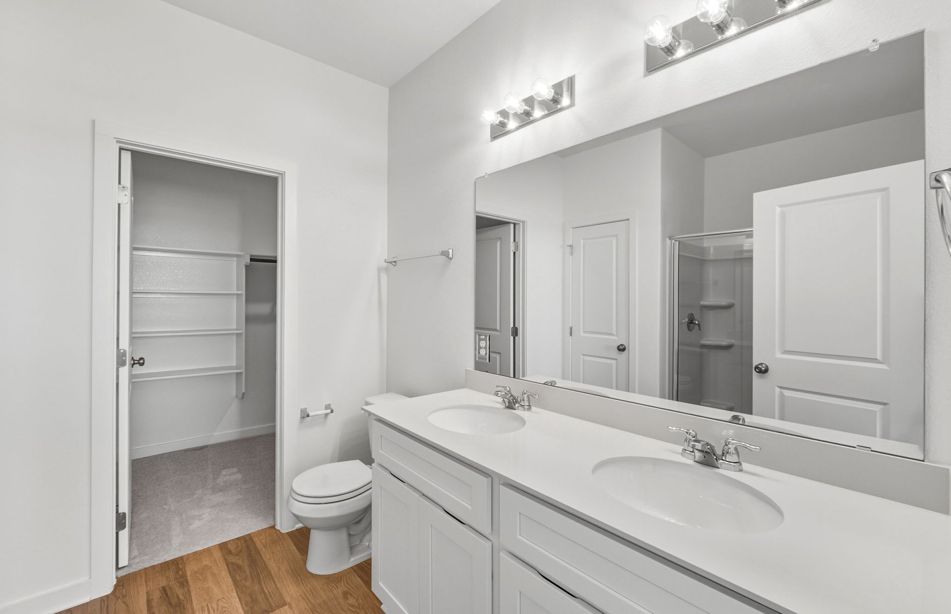 104 Eagle Valley Drive Elgin, TX 78621 - Photo 9 of 18 a bathroom with a granite countertop sink toilet and shower