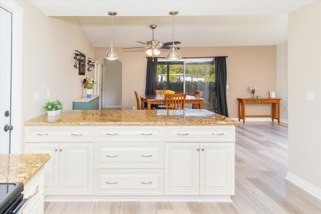 24093 Sargeant Road Ramona, CA 92065 - Photo 13 of 57 a bathroom with a sink and a large mirror