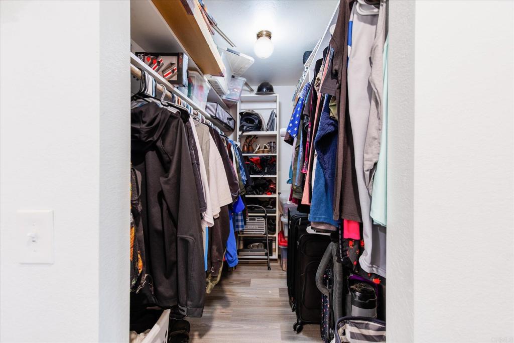 24093 Sargeant Road Ramona, CA 92065 - Photo 22 of 57 a view of walk in closet with clothes