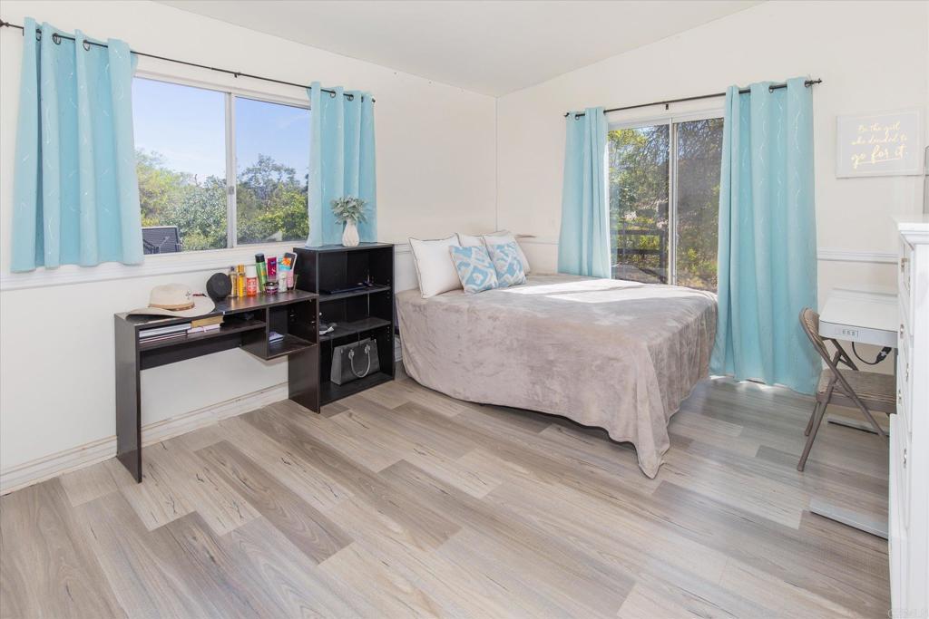 24093 Sargeant Road Ramona, CA 92065 - Photo 23 of 57 a living room with a bed furniture and a large window