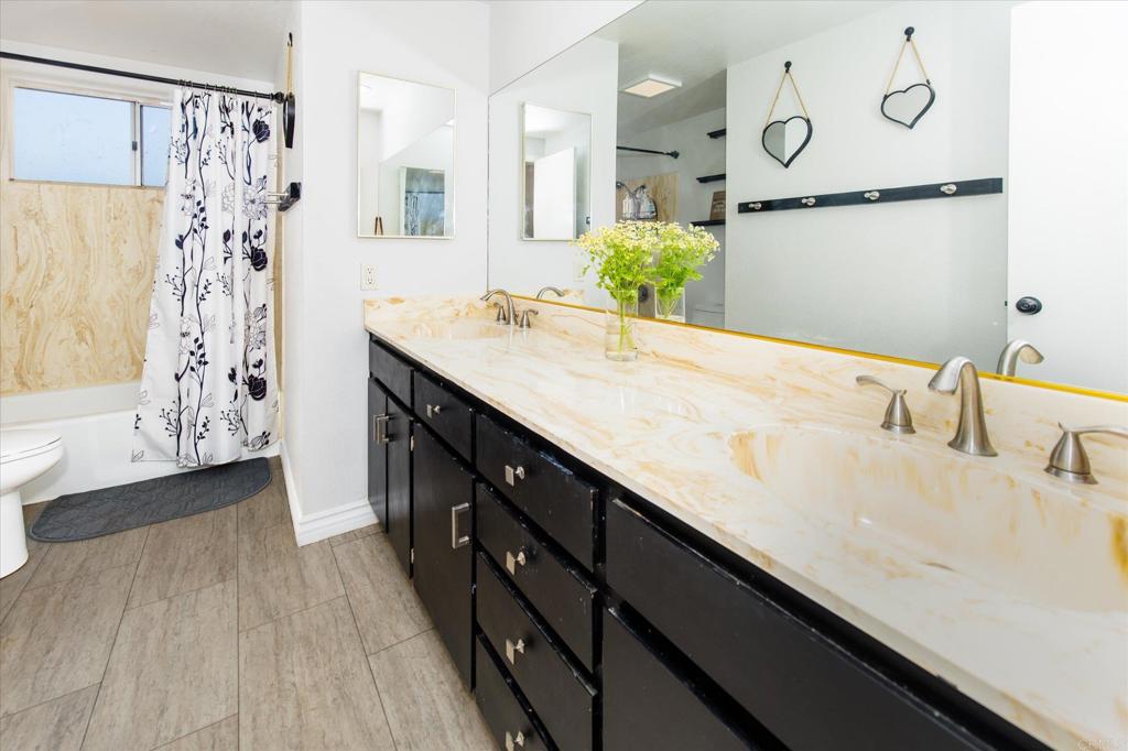 24093 Sargeant Road Ramona, CA 92065 - Photo 26 of 57 a bathroom with a sink and a mirror